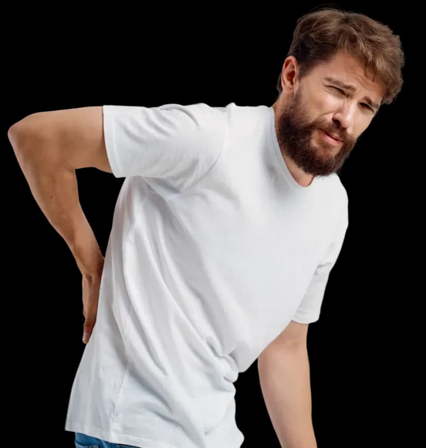 Man experiencing lower back pain before physiotherapy treatment at home in Dubai