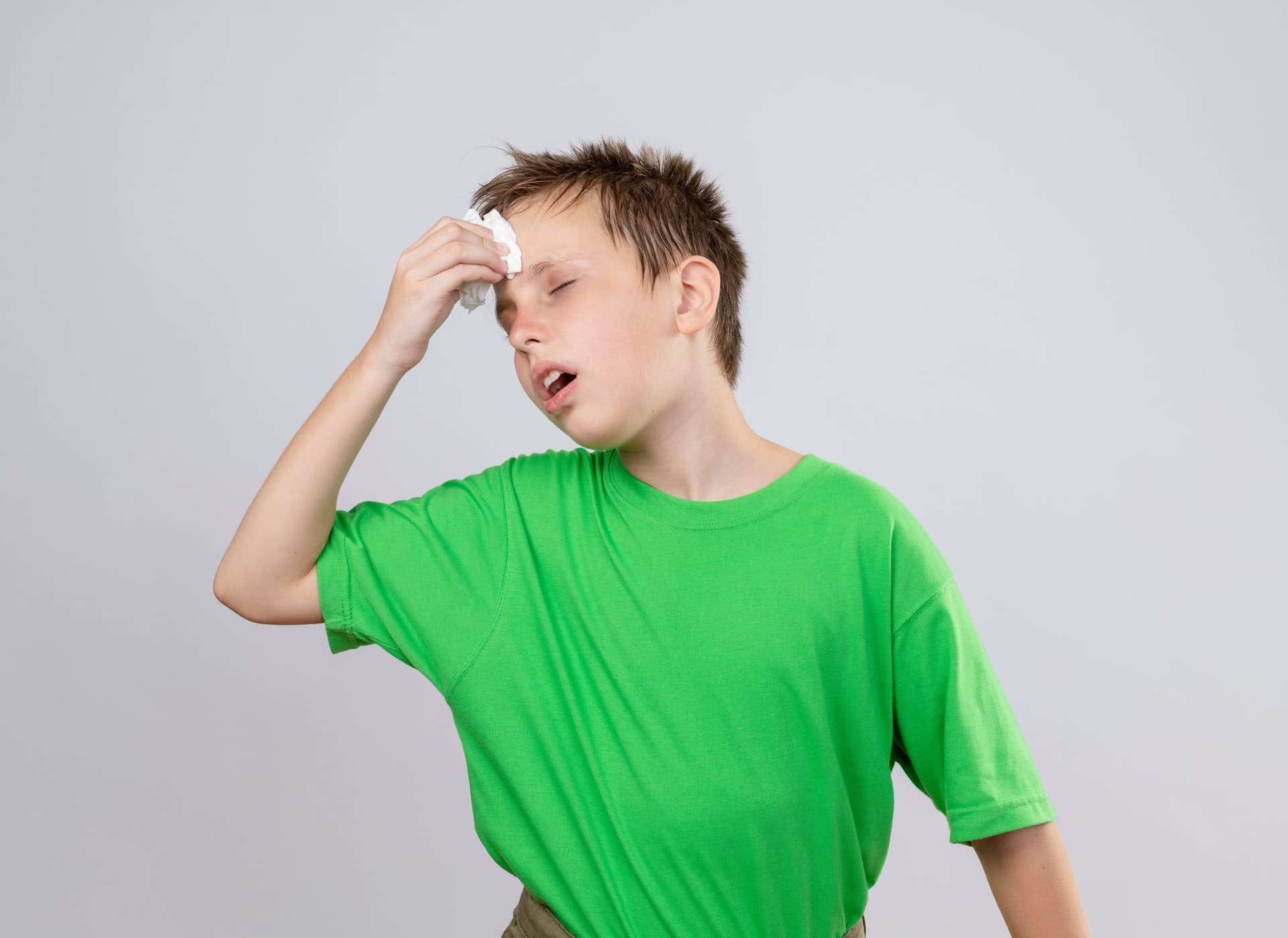 Child feeling unwell with heat illness symptoms