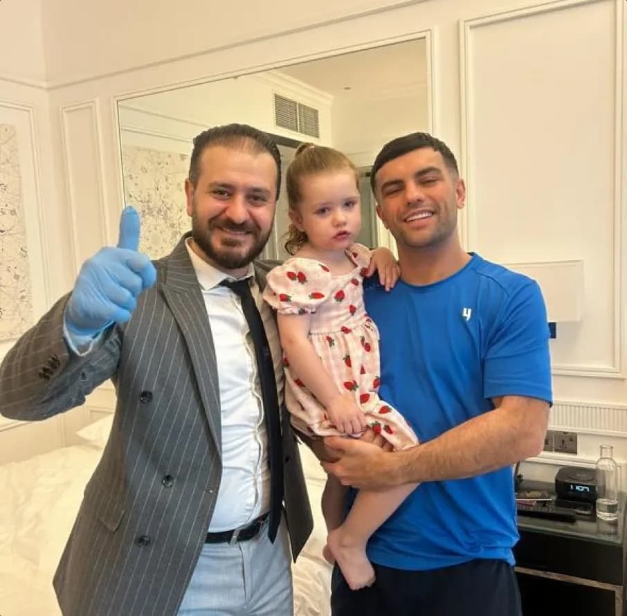 First Response Healthcare doctor and satisfied father giving thumbs up after pediatric home care in Dubai
