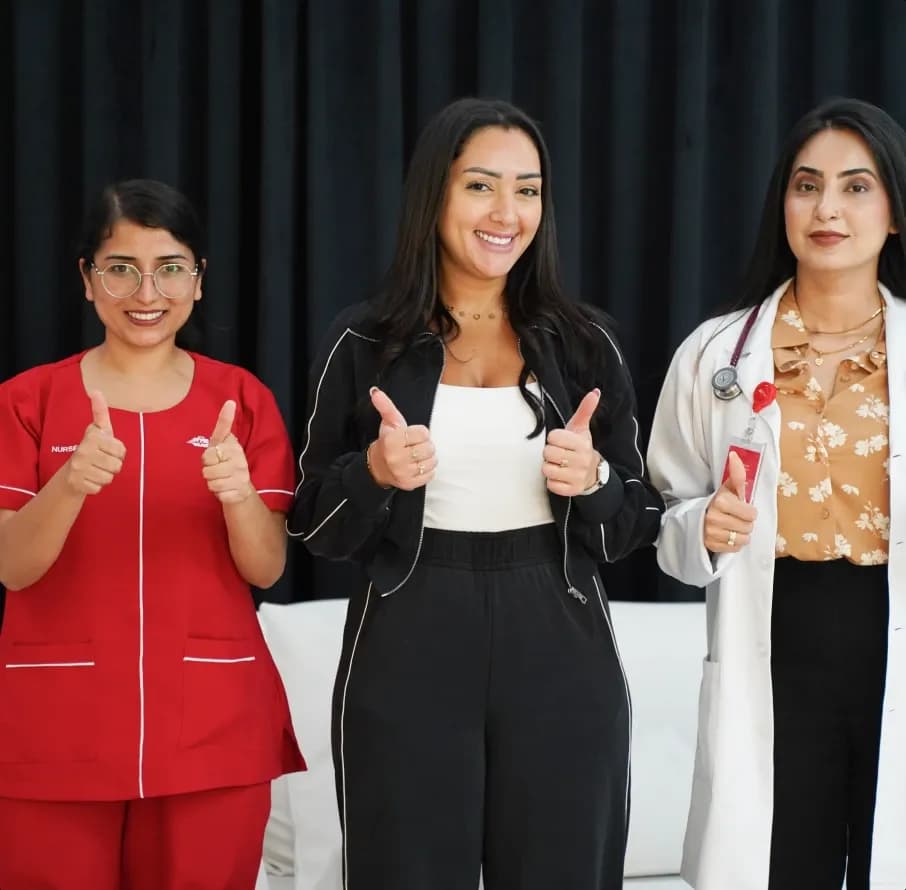 First Response Healthcare nurse and patient giving thumbs up after a home visit in Abu Dhabi