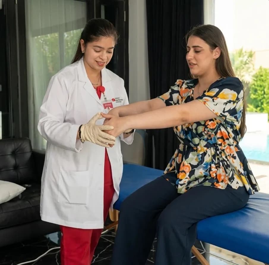 DHA-licensed physical therapist from First Response Healthcare delivering expert, customized home physiotherapy care to a patient in Dubai.