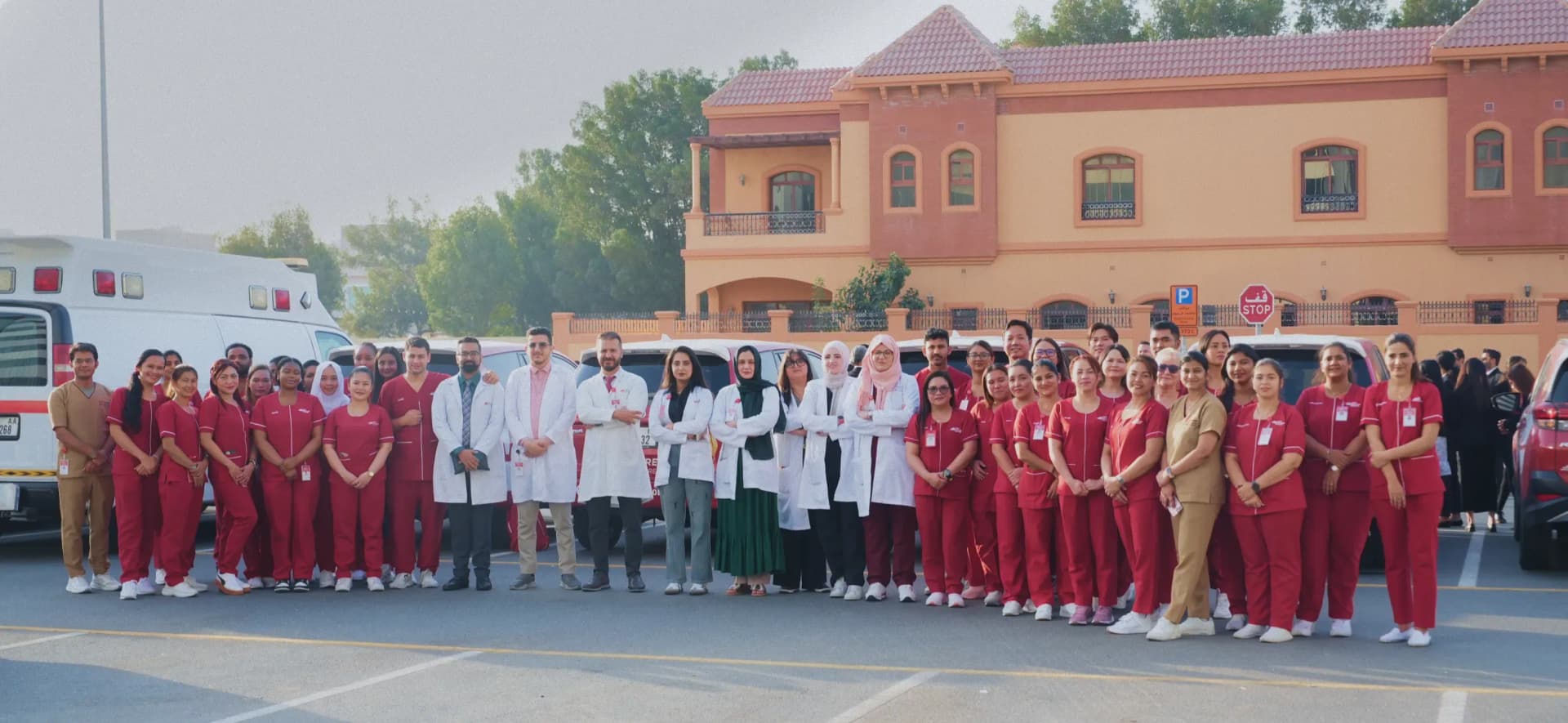 Group photo of First Response Healthcare medical professionals and staff standing together outdoors.