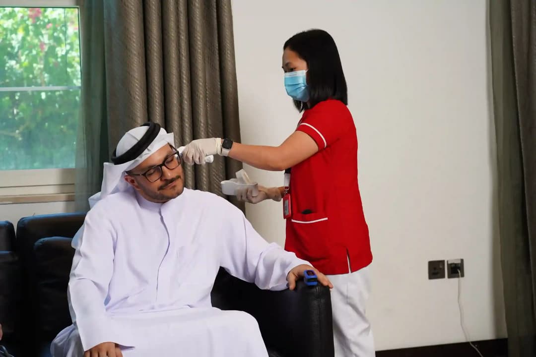 First Response Healthcare nurse providing care to a patient at home in Dubai