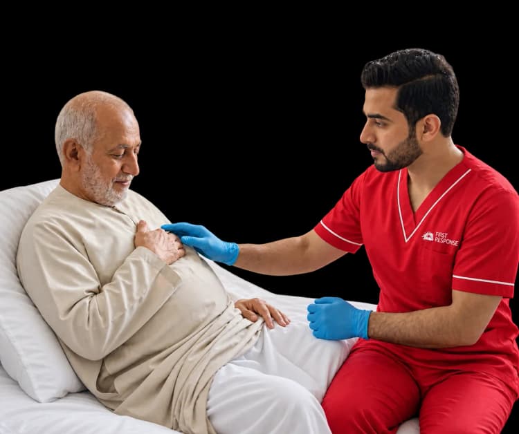 Elderly man receiving catheter care at home in Dubai.