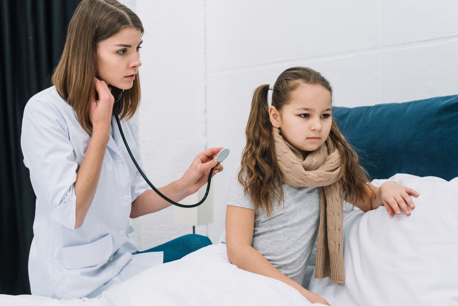 doctor checking iron deficient child at home