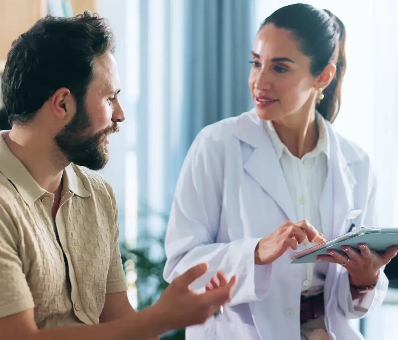 Doctor explaining full body health checkup results to a male patient in Dubai