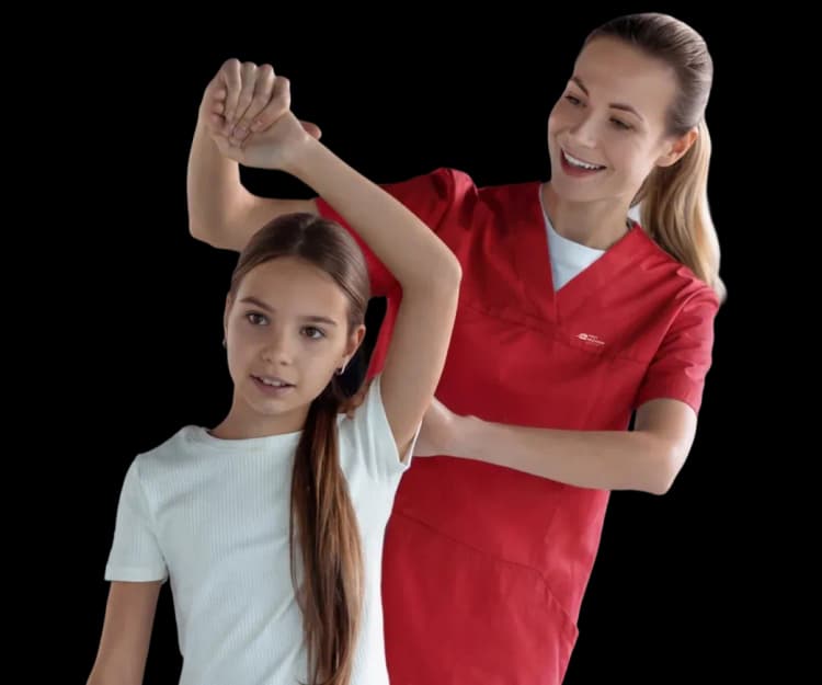 DHA-licensed pediatric physiotherapist helping a smiling young girl with arm stretching and mobility exercises at home in Dubai.