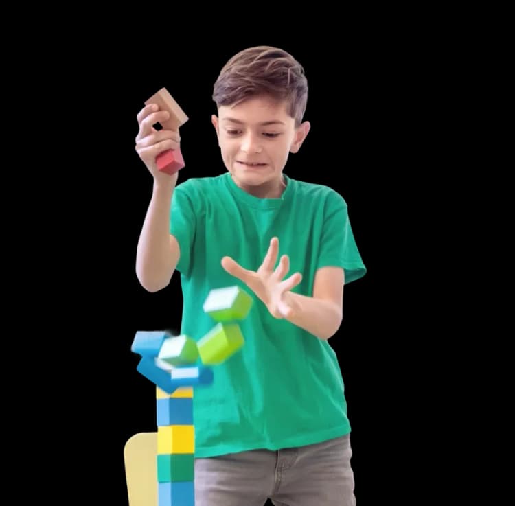 Smiling boy participating in fun, play-based pediatric physiotherapy exercises at home in Dubai.