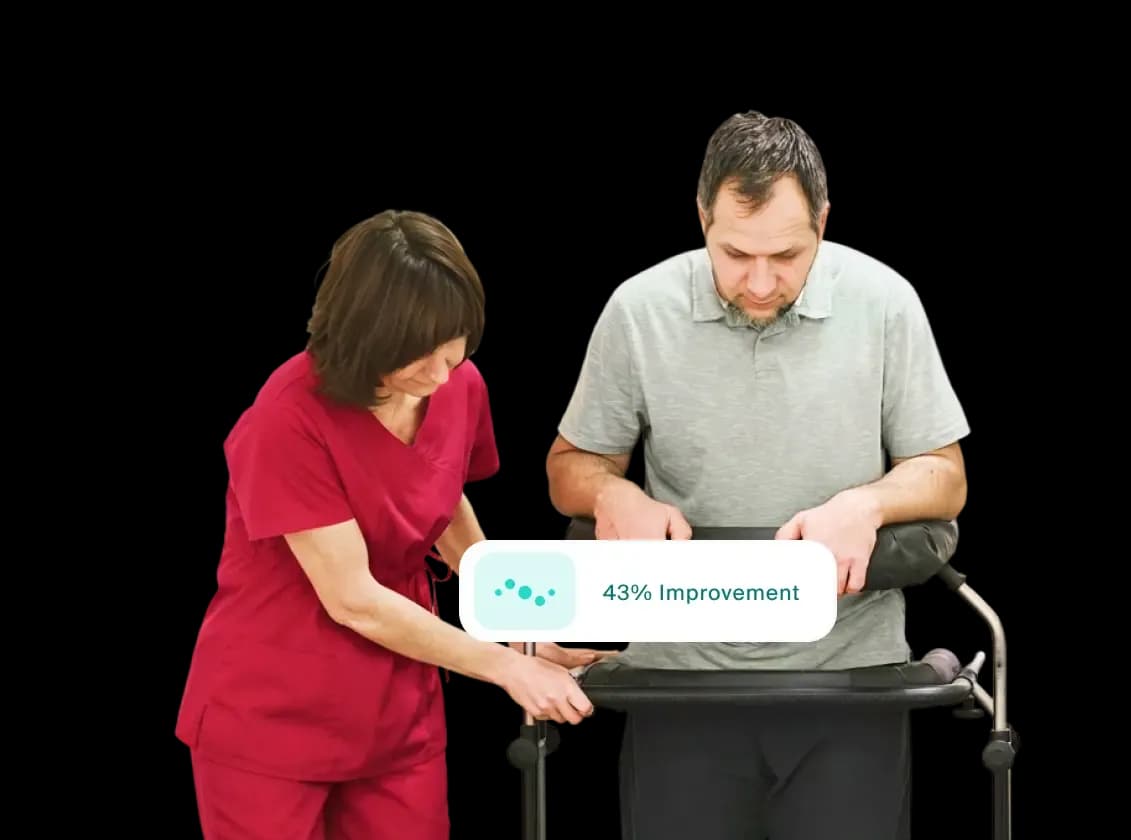 Healthcare professional tracking a neurological patient's rehabilitation progress using a tablet.