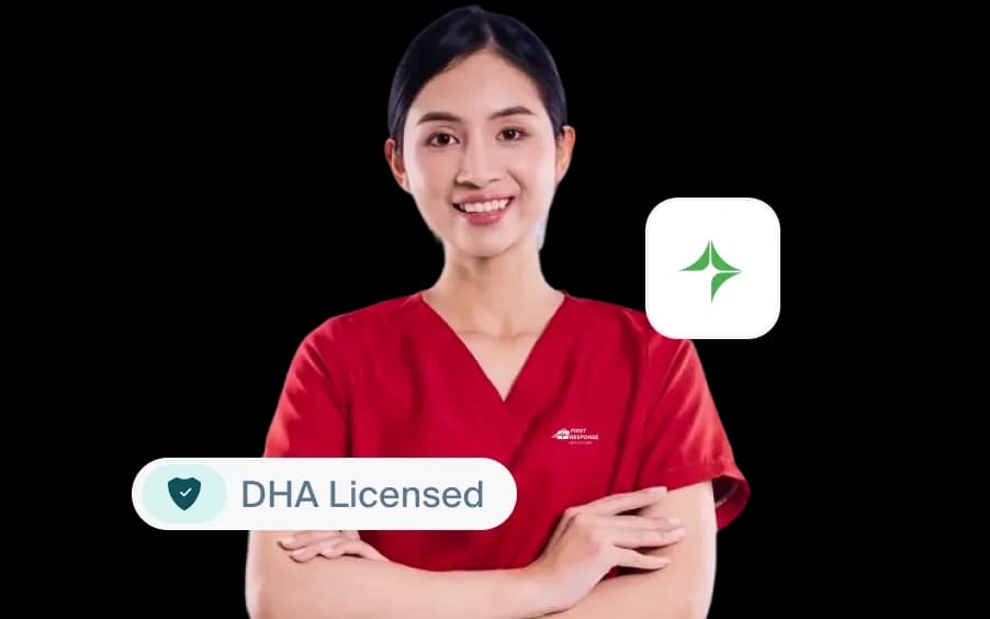 A smiling female home-care nurse in professional red scrubs with a "DHA Licensed" badge graphic overlay, representing safe and trusted medical administration.