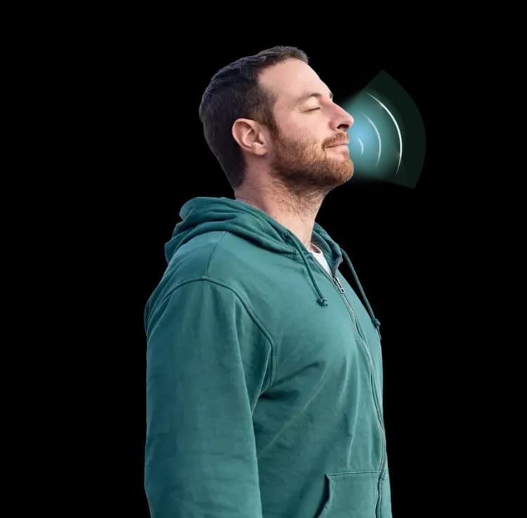 A patient performing controlled deep breathing exercises for lung capacity training.