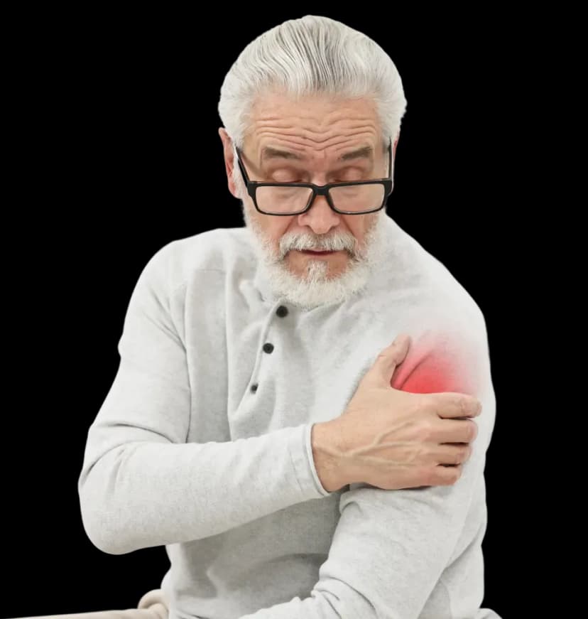 Elderly man holding his painful, stiff shoulder highlighting who can benefit from frozen shoulder physiotherapy at home in Dubai.