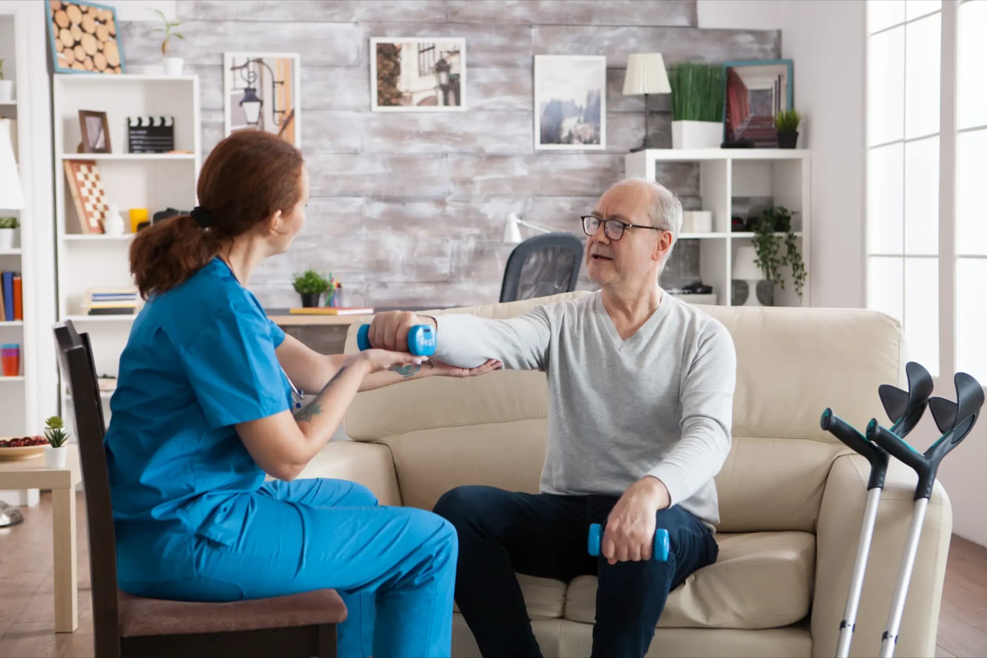 nurse-doing-physiotherapy-treatment-nursing-home-with-senior-man