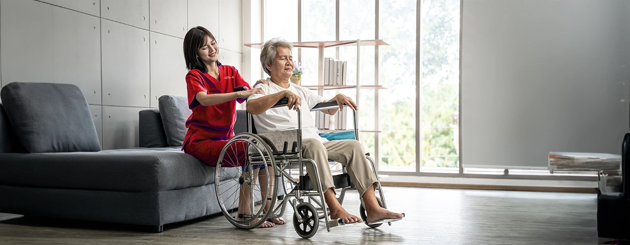 Nurse helping a senior patient at home