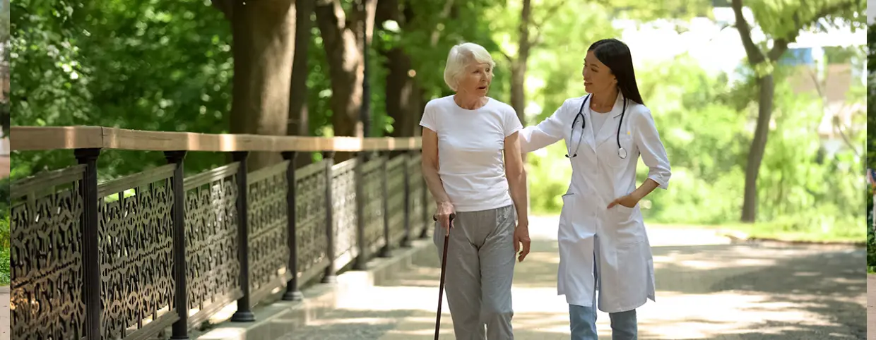 Doctor taking a walk with a senior patient