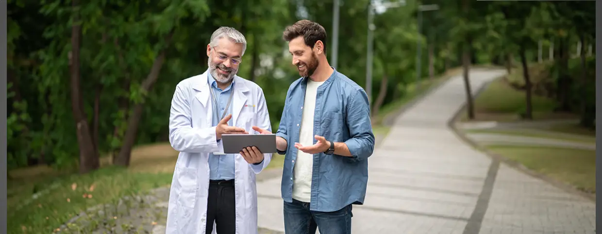 doctor using mobile to access medical records of tourist