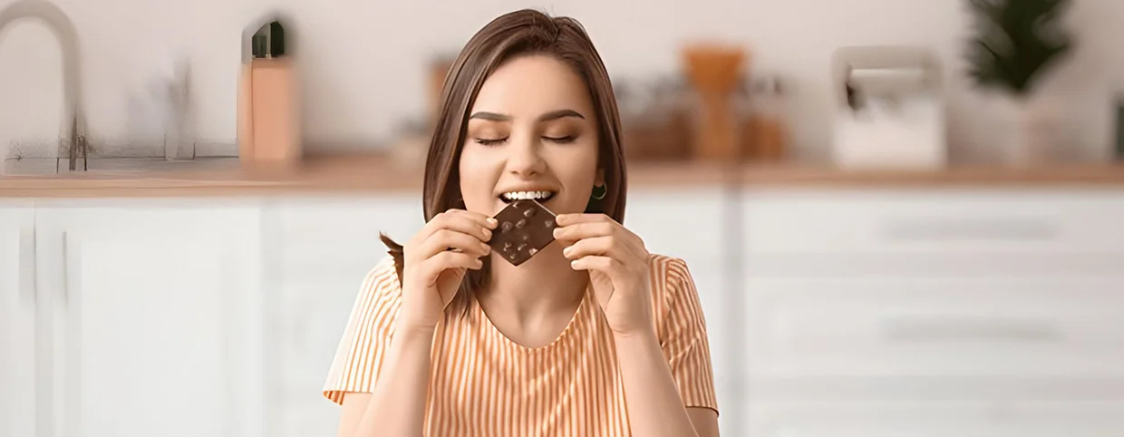 Person eating a chocolate