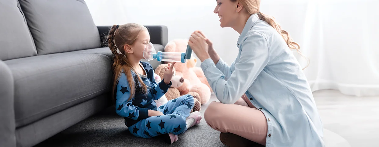 Mother playing with her daughter who is suffering from asthma