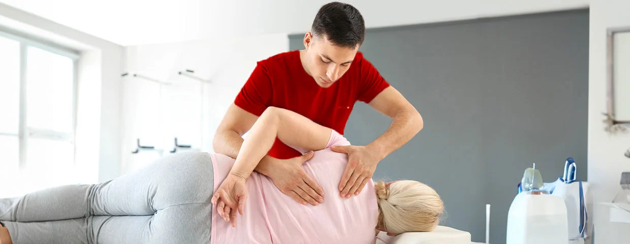 Physiotherapist using key techniques to relieve Herniated Disc Pain