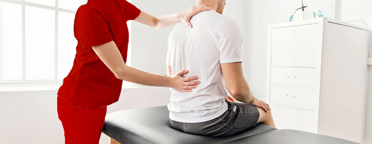 Physiotherapist treating a patient