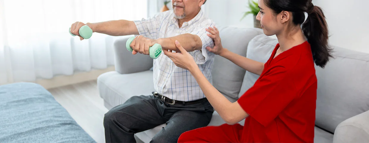 Physiotherapist helping a Senior patient to manage Chronic Pain in Dubai