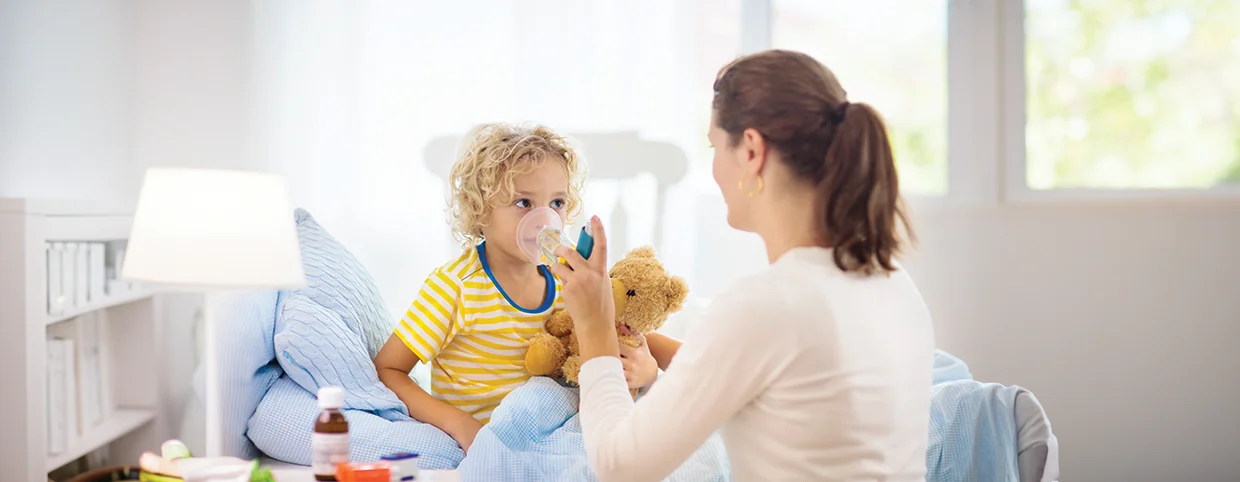 Mother taking care of son who has asthma