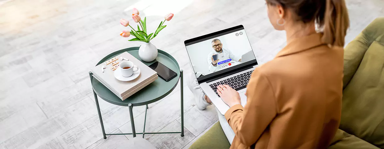 Woman Getting consulted online by a doctor in Qatar