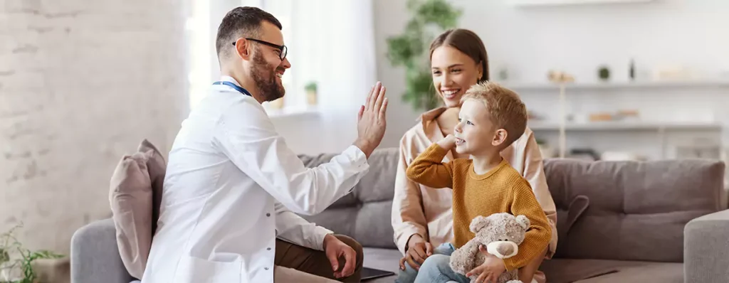 Doctor giving hi-fi to a small kid