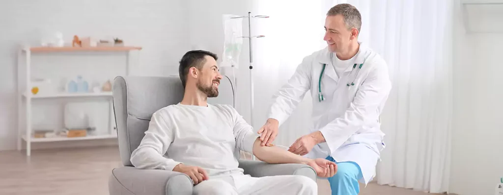 Doctor administering IV drip to patient