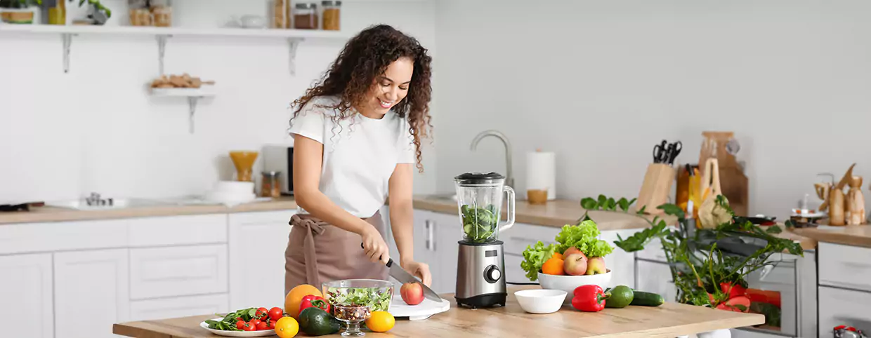 A woman cooking healthy summer meals for frequent eating