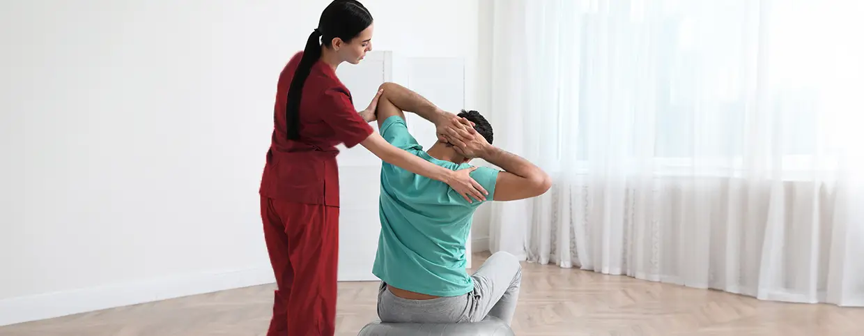 Physiotherapist giving treatment to the patient