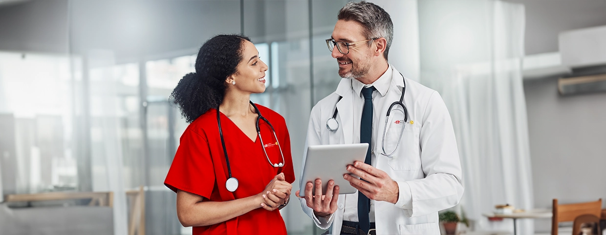 Doctor and nurse checking reports