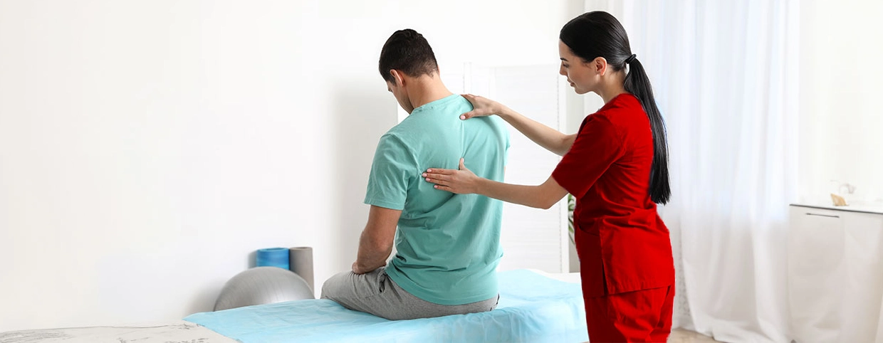 Physiotherapist providing orthopedic physiotherapy to patient