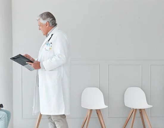 Doctor giving consultation to patient at hotel