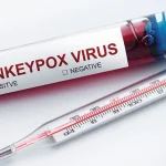 Image of thermometer and test tube labeled ‘Monkeypox Virus’