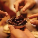 A group of people sharing dates a part of a healthy Ramadan meal plan