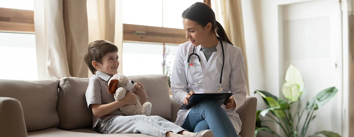 Pediatric doctor with reports in hand, talking to the child